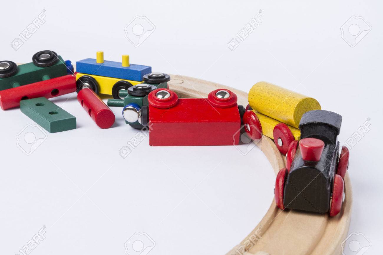 24831298-derail-wooden-toy-train-in-top-view-horizontal-image-Stock-Photo.jpg