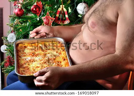 stock-photo-fat-man-with-lasagna-baking-during-christmas-holidays-169018097.jpg