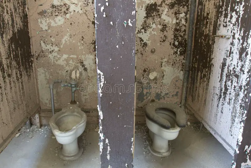 dirty-decaying-toilet-stalls-toilets-57755922.jpg